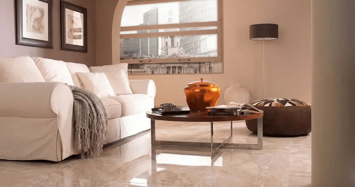 Modern living room with professionally installed marble flooring, a beige sofa, coffee table in Boulder, CO