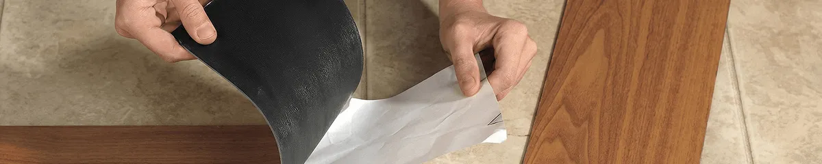 A professional installing vinyl flooring in Boulder, CO